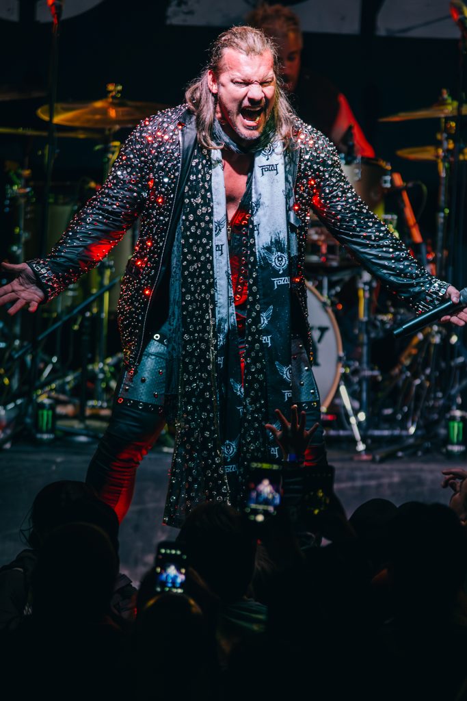 TBAYALIVE Custom Gem TBAYALIVE said An energetic and atmospheric concert photograph of a male vocalist performing with intense emotion under vibrant, high-contrast stage lighting; the shot captures raw stage presence and authentic storytelling, reflecting TbayAlive’s signature cinematic style and decade-plus experience in Thunder Bay’s live music scene.